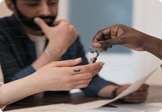 Hands exchanging keys